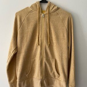 Mustard colored size medium zip up hoodie. In good condition.